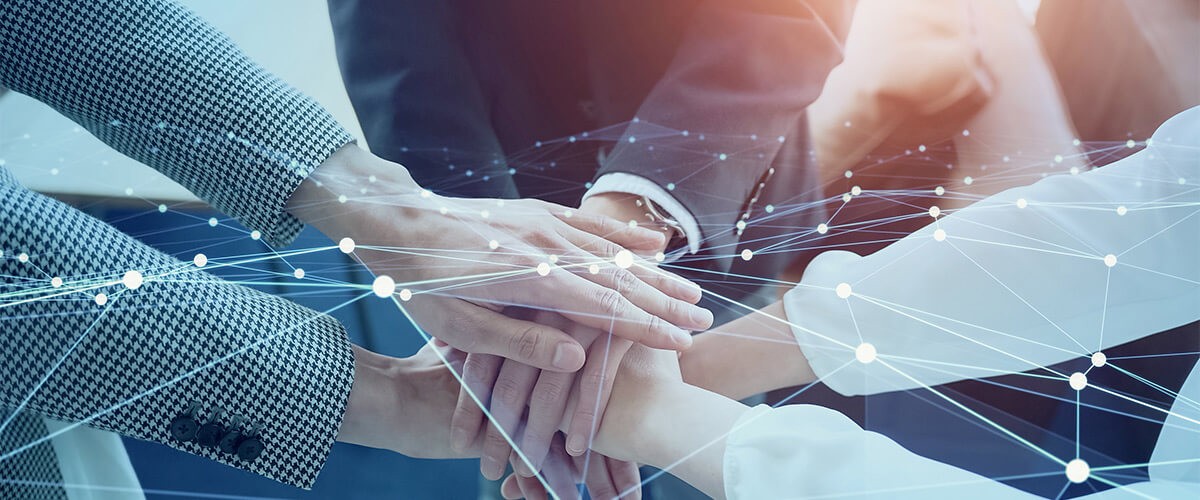 What’s the value of partnership? This Microsoft leader explains why the power of partnership is the key to making the impossible, possible. Hands in a huddle. Partner ecosystem, IT partners, Artificial Intelligence