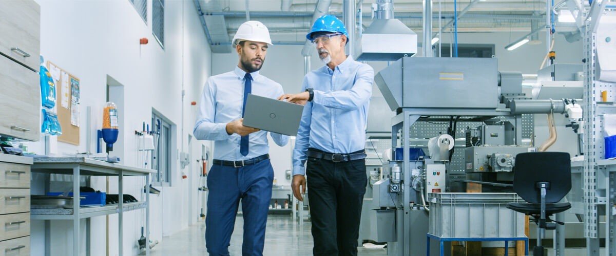 Automation Infrastructure Deployment Business professionals walking in factory