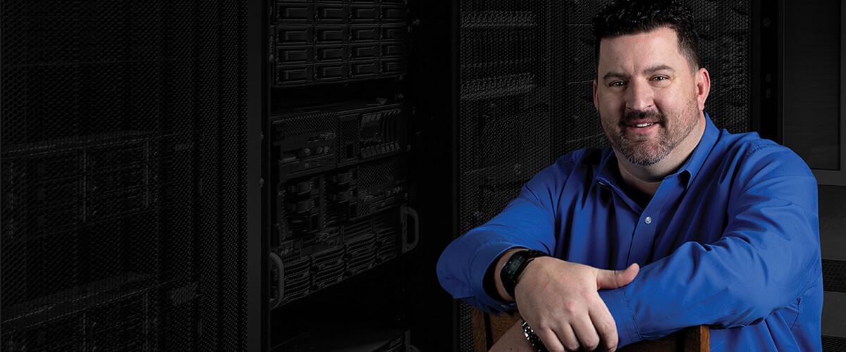 Insight helped expand their remote work capabilities, while also helping get back their transformation goals. Dan Groves, VP of IT for Westerra Credit Union sits in front of a server rack.