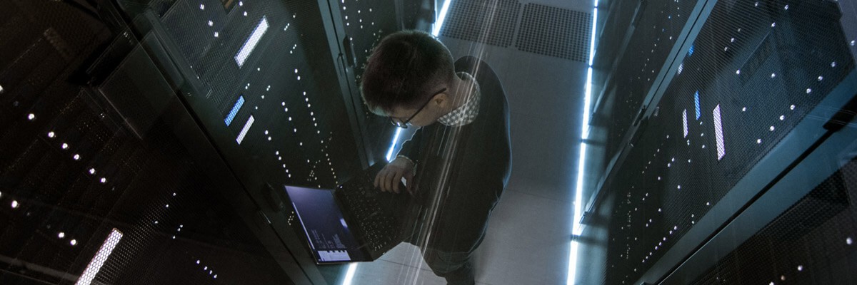 Explore the benefits of the IBM FlashSystem family for your organization. Network admin in modern datacenter powered with IBM FlashSystem storage.