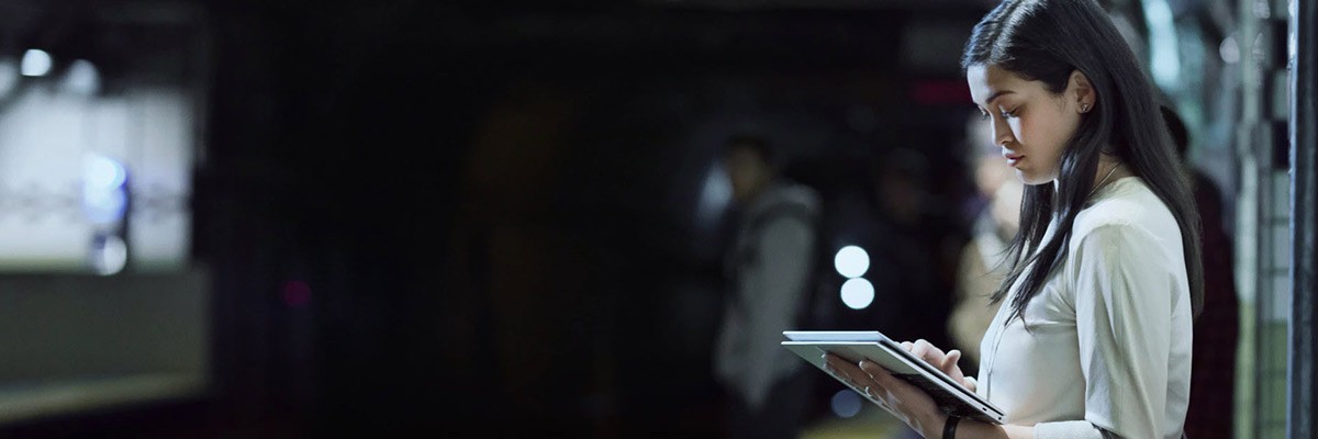 Secure Hybrid Work With HP Wolf Security Woman using HP device