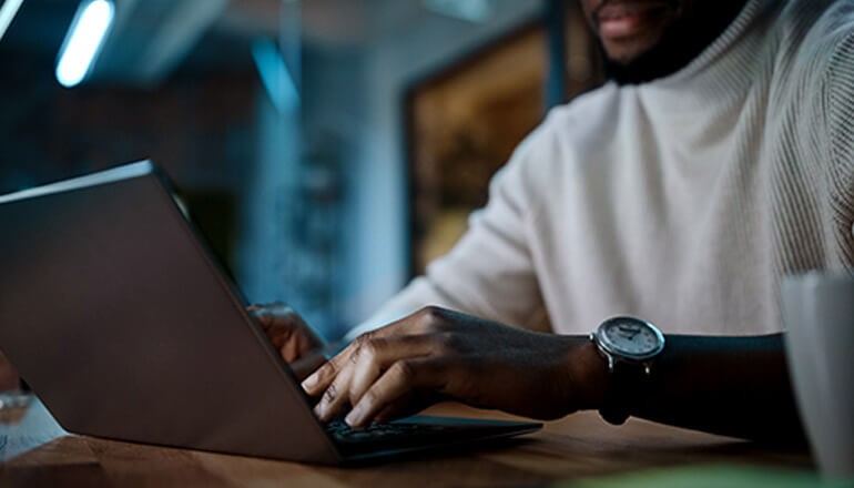 Azure Sentinel & the Azure Security Center helps stop threats before they cause harm. Business professional working off laptop computer. Microsoft Azure, Azure Sentinel, cloud native security, cloud security, SIEM, SOAR, enterprise security, cybersecurity, threat detection, threat prevention