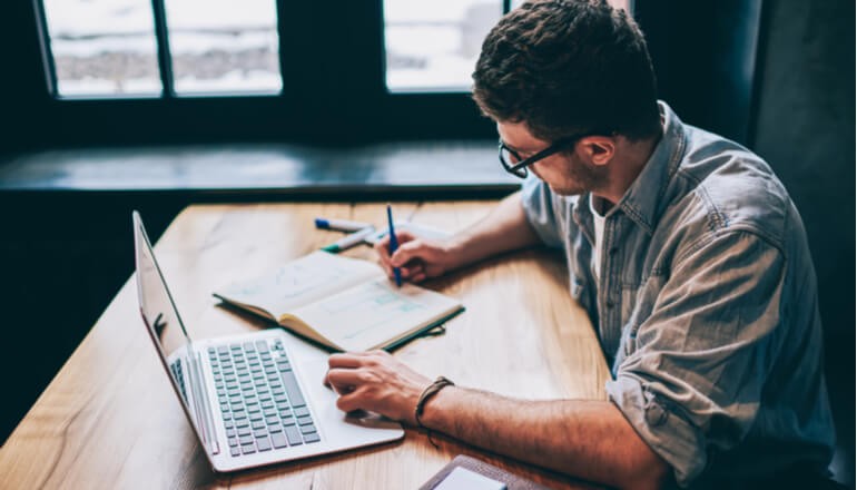 Apple Management Made Easy with Insight and Jamf User working on laptop