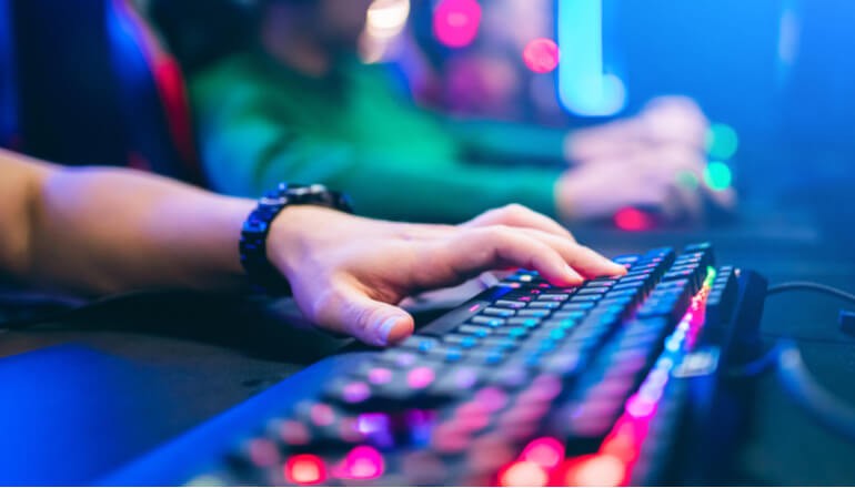 Esports in Education webinar User in esports typing on keyboard