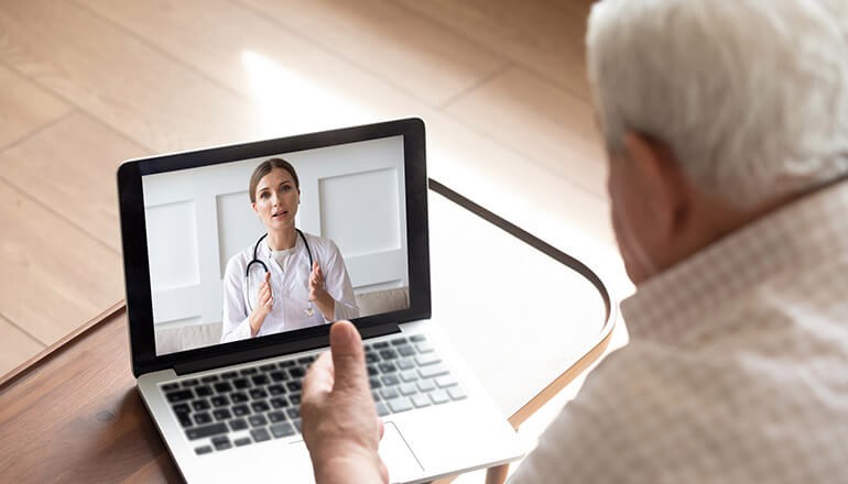 Effectively manage veterans with chronic conditions from their home through a centralized SaaS platform Retired veteran using a centralized SaaS platform to speak with a Teledoc