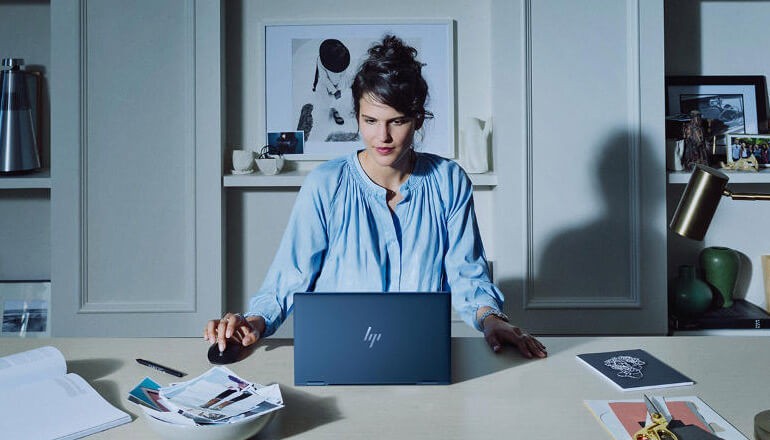 Learn how to keep your data safe and endpoints protected against cyberattacks from Insight and HP. Woman on secure HP computer. HP Wolf Security, cybersecurity, cyberattacks, endpoint security
