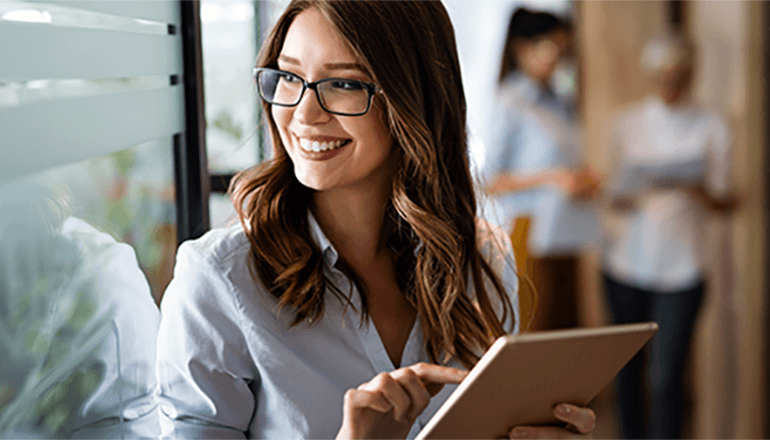 Layered protections are the most reliable way to protect your workforce and enhance native Microsoft defenses. Woman smiling and looking off in the distance. Mimecast, Email Security Cloud Integrated, email security, Microsoft 365, AI security, cyberattack security, ransomware protection