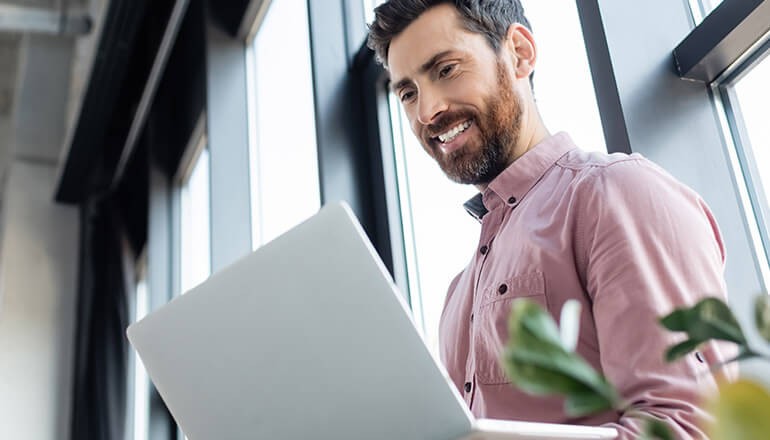 Insight and ChromeOS can power your workforce with robust productivity and lower total cost of ownership. Businessman using ChromeOS on laptop device. ChromeOS, enterprise devices, operating system, ChromeOS devices, ChromeOS for business