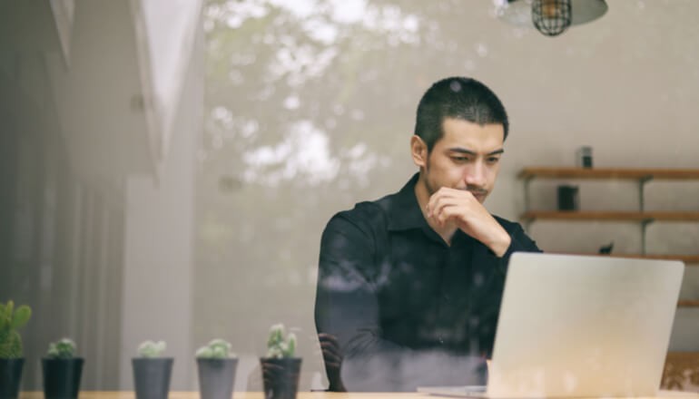 Cloud & Data Security Man working on laptop