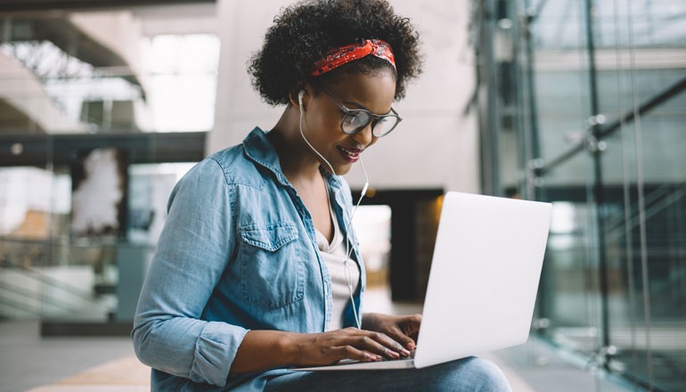 Simplify deployment and management across your entire device fleet Man using laptop for work at home. Windows 11, Device deployment, device manageability, deployment and manageability