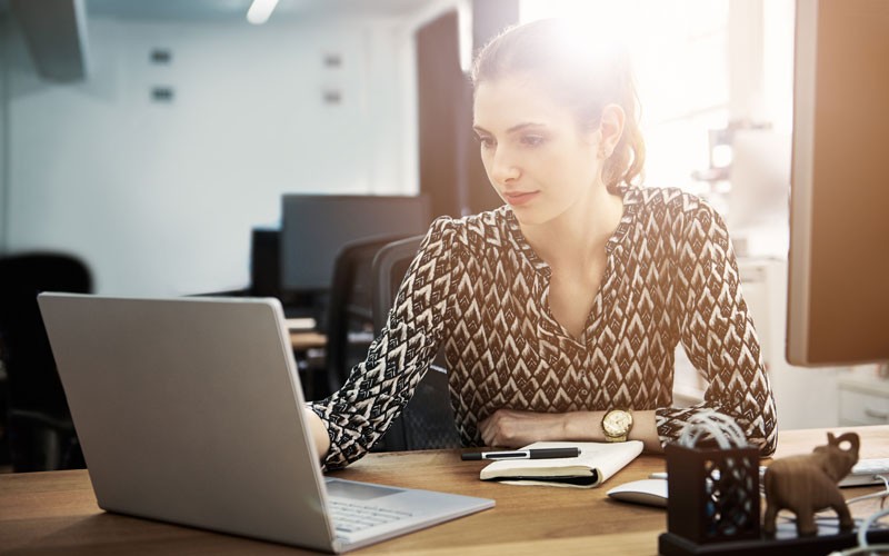 8x8 undergoes annual internal and external infrastructure audits in compliance Woman on laptop device