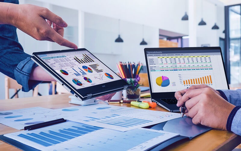 Empower your workforce. Teammates working together using a laptop