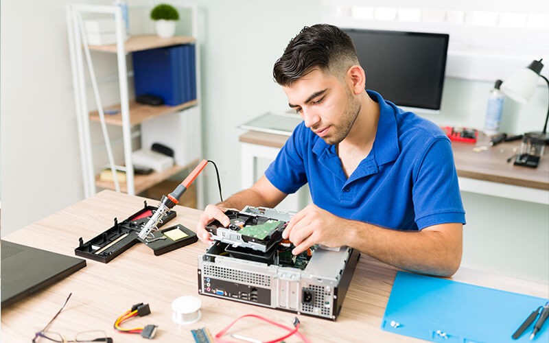 Endpoint warranty protection Man fixing electronics and peripherals
