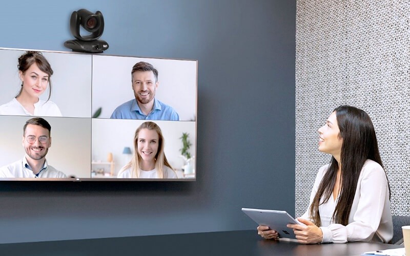 Upgrade your meeting hardware. Woman having a meeting using AVer Cam550