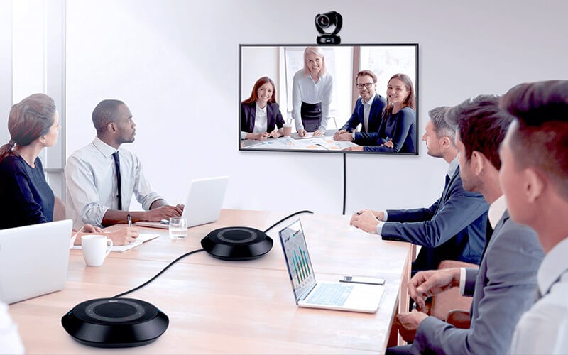 Effortless collaboration Teammates collaborating together using a AVer VC520 Pro 2