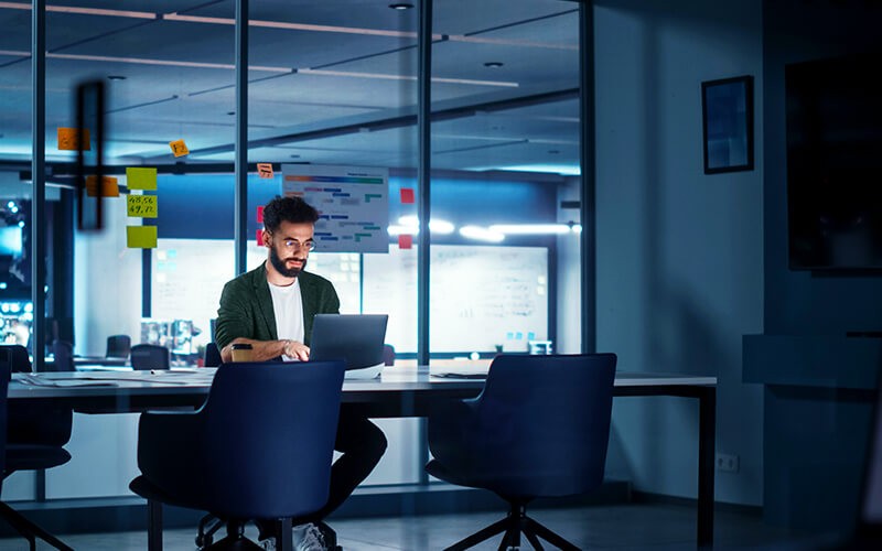 Data protection and compliance Man working late at the office