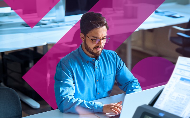 Advanced data security individual using laptop at table