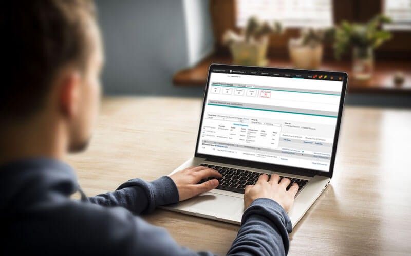 Carbon Black Protection Male employee working on laptop with Carbon Black Protection displayed