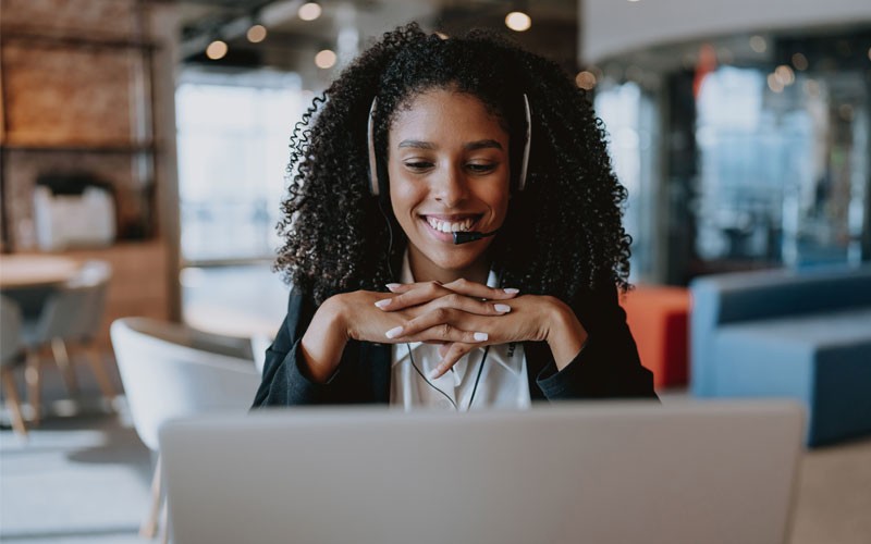 Why Insight for Cisco products? Smiling businesswoman with headset on a conference call