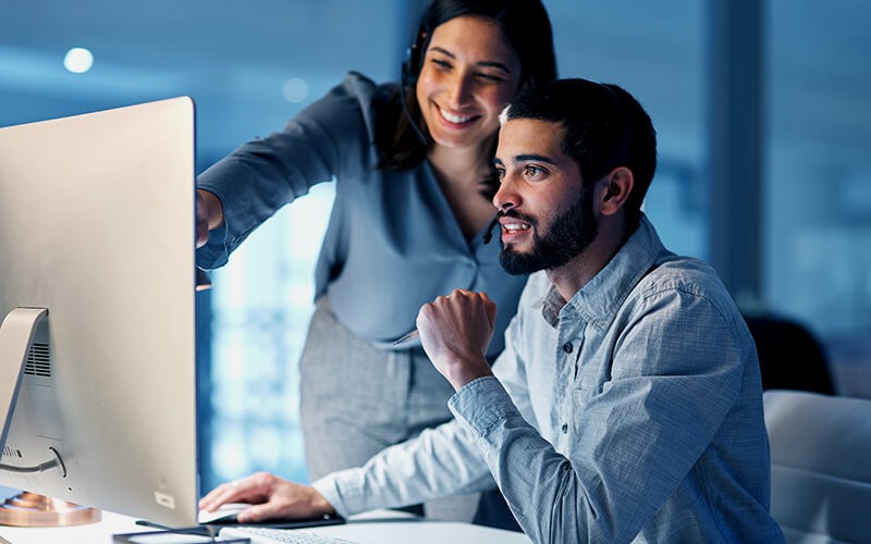 Commvault solutions Two person collaborating with each other