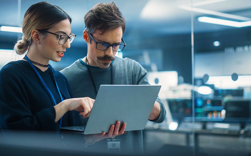 Backup and recovery Two person with glasses working together