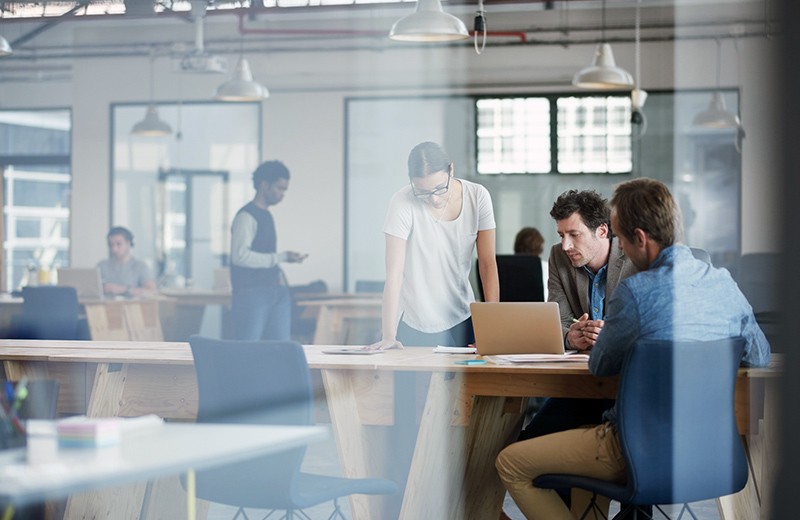 Build and scale your cloud apps with DataStax Open office with group of employees collaborating