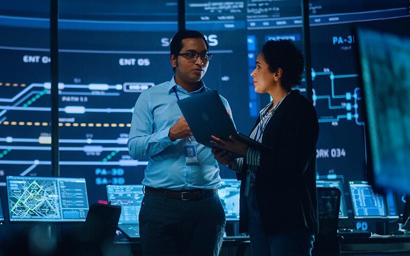 Ericsson builds a more connected world. Teammates working together at the office