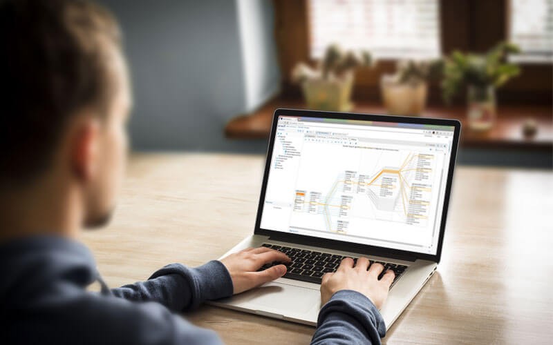 Centralized data governance simplifies enterprise decision-making Man working on laptop data governance