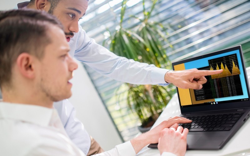 Try Chrome Enterprise Upgrade Two users working on laptop