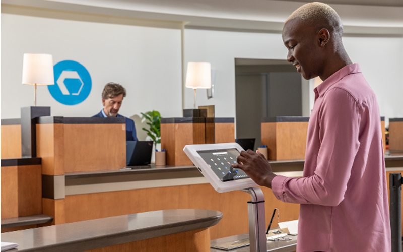 Not only can customer self-service alternatives lower costs and increase revenue Professional using tablet