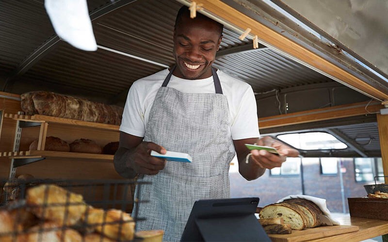 Manage dispersed teams. Man selling breads