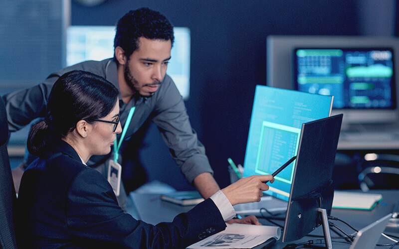 Stronger security from application to endpoint Teammates working together at the office