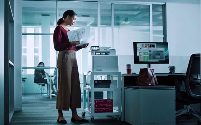 New breed of endpoint security Woman standing in front of her station