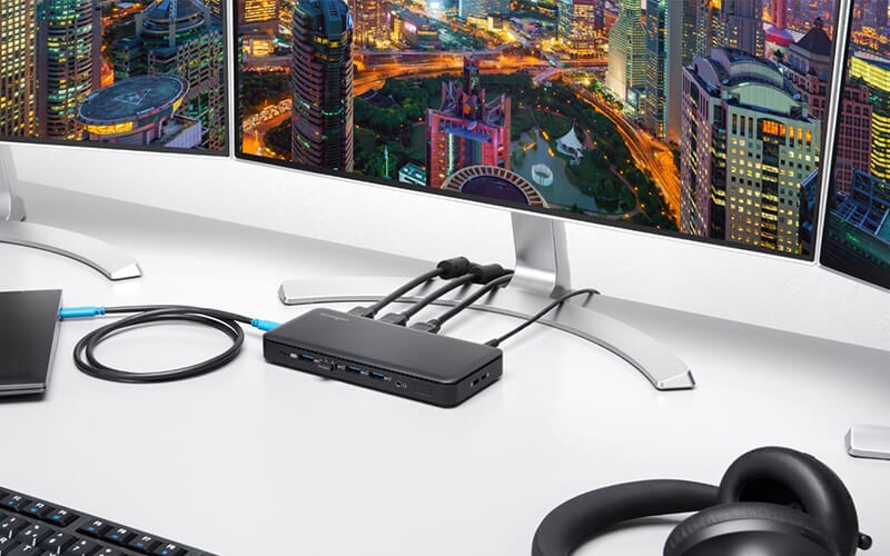 Your gateway to productivity Two monitor with gateway and headphones