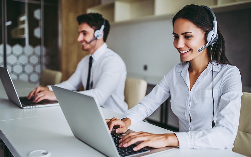 Analyze and manage massive volumes of disparate sources Professionals working on their laptop