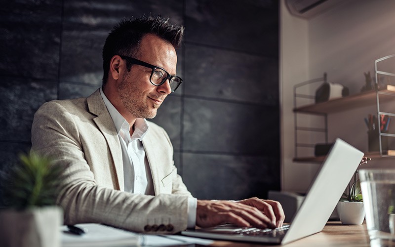 Obtain actionable information from real-world Internet of Things (IoT) Professional working on his laptop