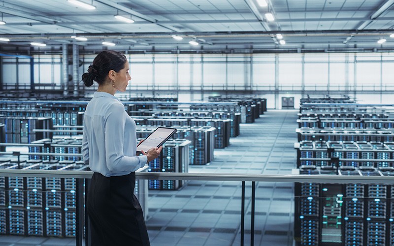 Micron® SSDs are built for performance, efficiency and low latency. Woman holding a tablet