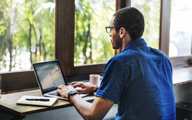 Maximize performance and reliability Business man using laptop