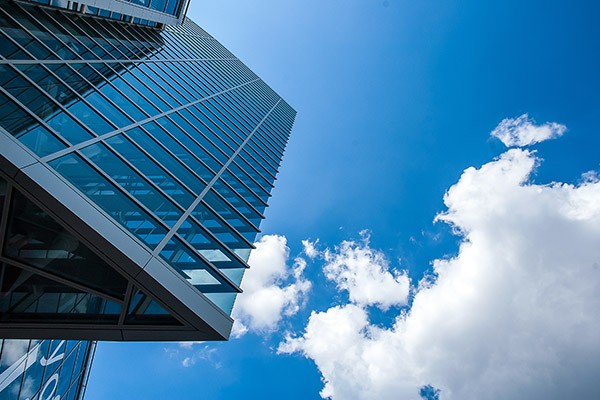 Unified communications solutions in the cloud Window pane with cloud passing by