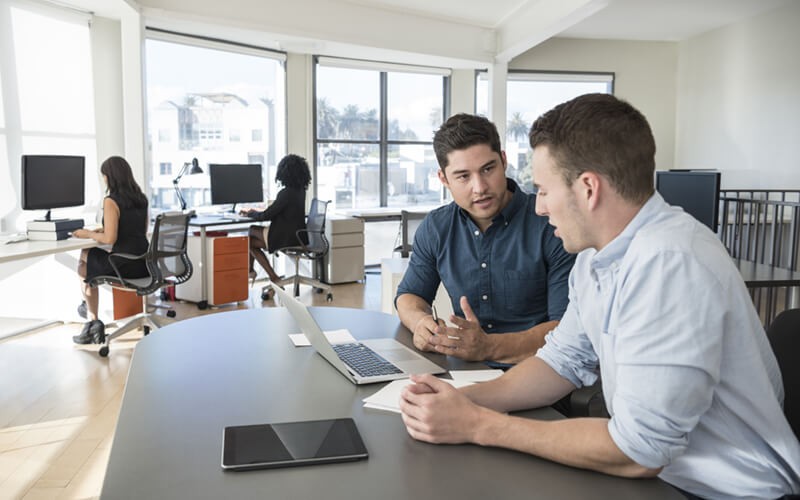 NetApp Cloud Sync Two men having discussion