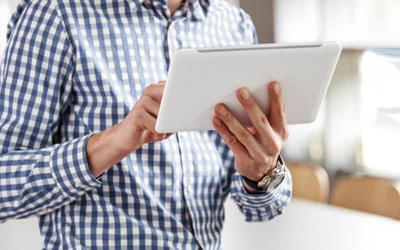 Give your team a truly unlimited eSigning experience with Nitro Sign™ Man holding tablet