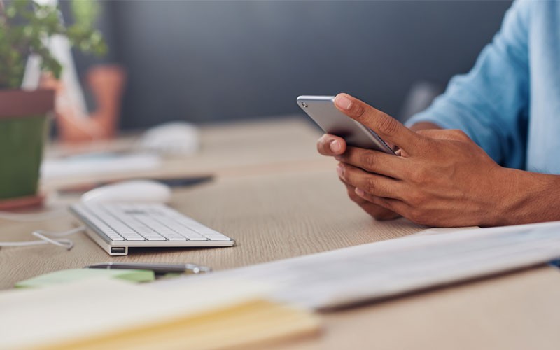 Virtualization and hybrid cloud solutions Close up of hands using mobile device