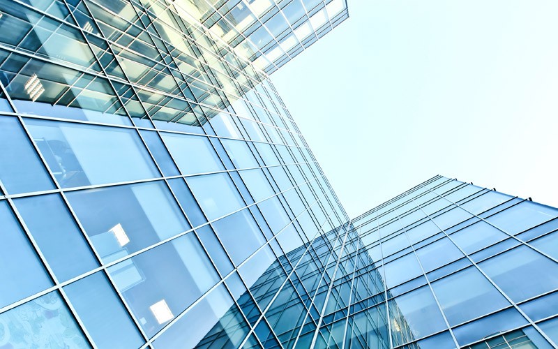 Simplify your IT, cut costs, and increase business agility with Oracle private cloud Office building with skyline