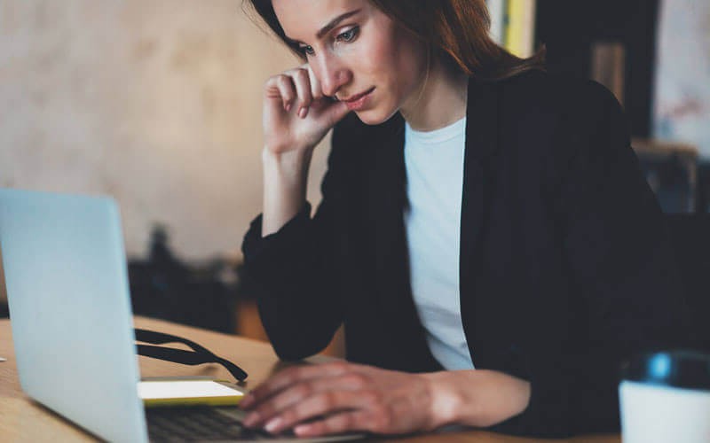 Experience technical and business flexibility Businesswoman focusing on work with laptop computer on desk