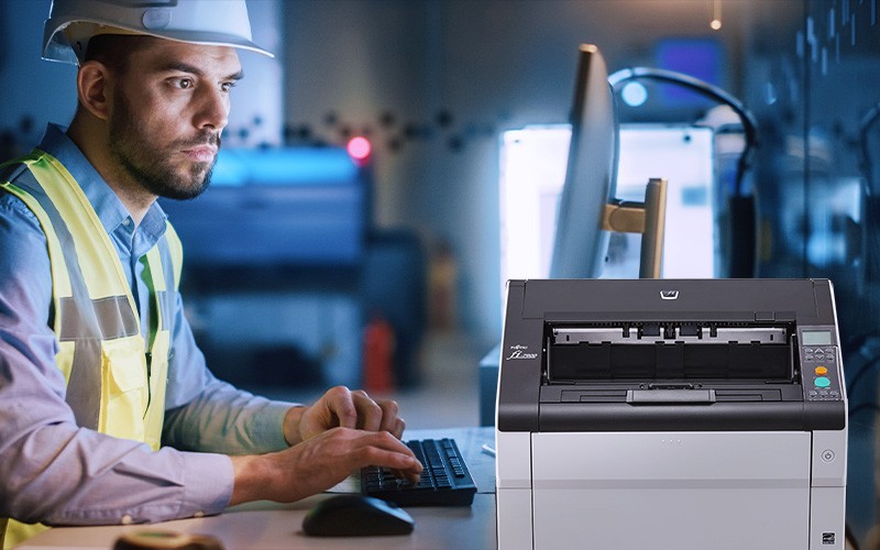 Remain competitive by embracing scanning technology that simplifies manufacturing from the factory floor Men working on a manufacturing factory