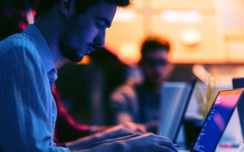 Protect your email system with SonicWall email security Business man working on laptop