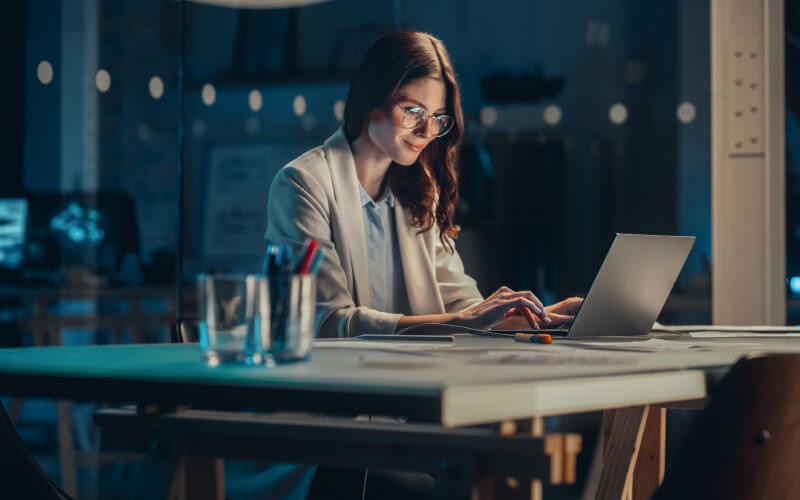 Secure access for your cloud resources. Woman usign her laptop at the office