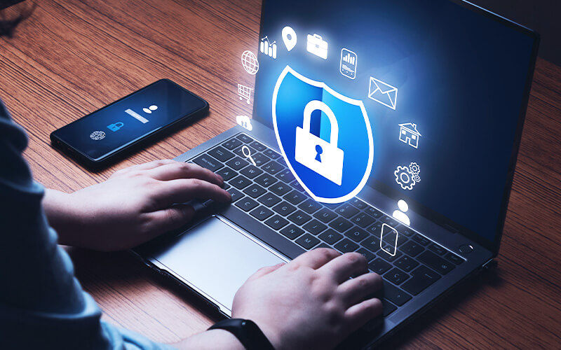 Keep your data safe Person using a laptop at work