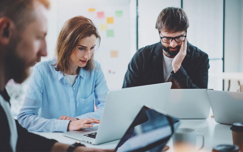 Enhance your backup strategy Team working at table