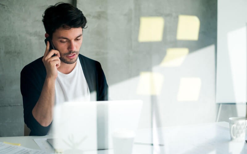 Defend mission-critical applications Young business professional on mobile device